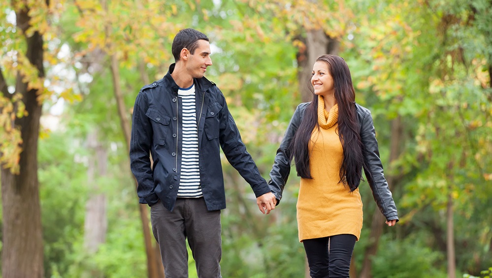 Ten couple at the park in autumn time