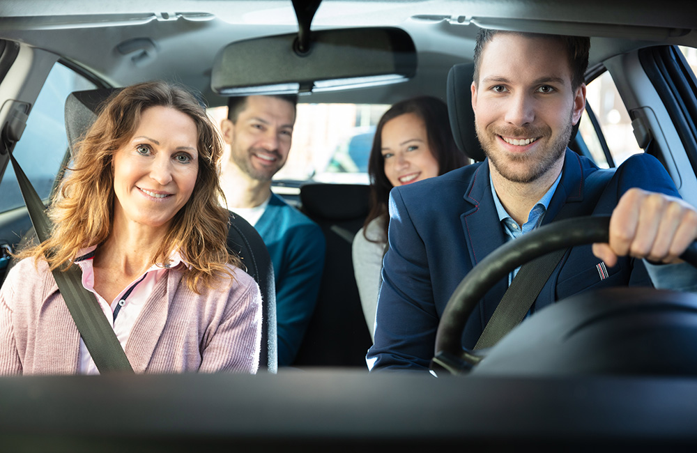 Smiling People Sitting In Car