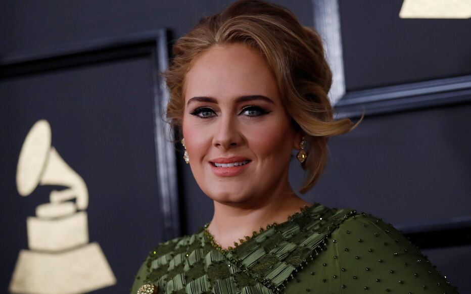 FILE PHOTO: Singer Adele arrives at the 59th Annual Grammy Awards in Los Angeles